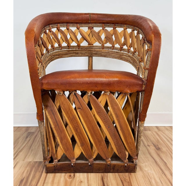 Traditional vintage Mexican Equipale barrel chair handcrafted from cedar and tanned pigskin. Crafted from branches bent to...