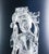 Rock crystal sculpture depicting a female figure (perhaps guanyin) with a bouquet of flowers. China, 20th century. Origin...