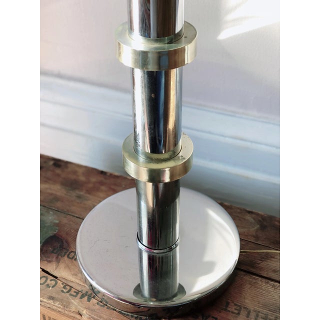 Mid century modern chrome and brass table lamp with brass ring accents. This lamp is in good vintage condition with only...