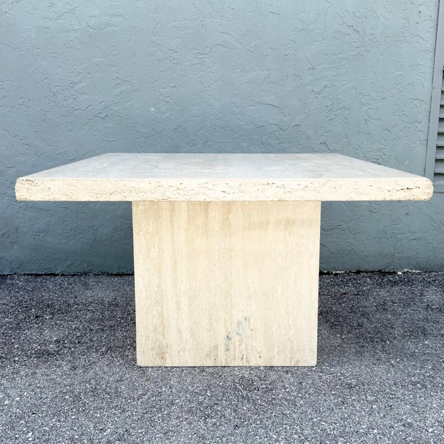 Pedestal: 26”w, 13.25”d, 28.25”h A striking vintage Italian dining table crafted in richly textured natural travertine....