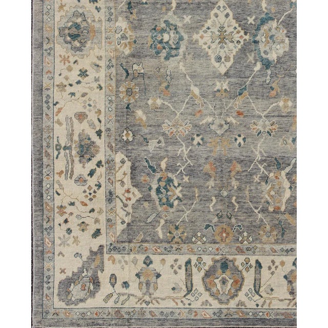 Tribal Design Turkish Oushak Rug by Keivan Woven Arts 10'3 x 14'3 Measures: 10'3 x 14'3. Turkish Oushak rug with bold...