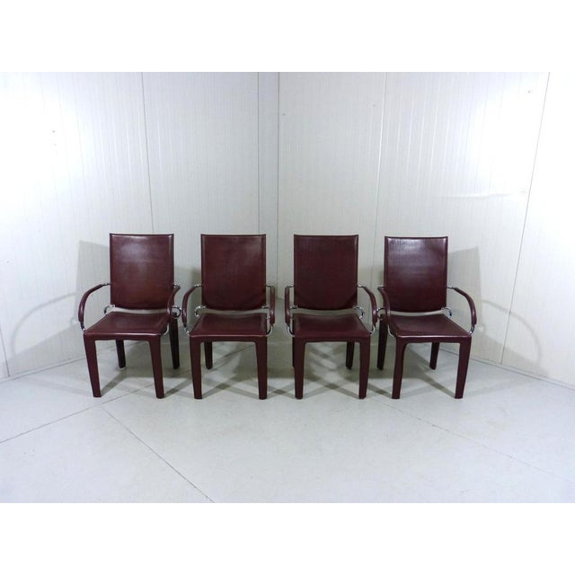 Set of 4 rare leather Arcadia dining chairs by Arper, Italy (marked). Chrome frame covered with think redbrown leather....