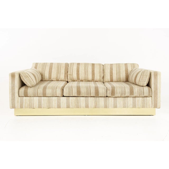 Milo Baughman Style Mid Century Brass Base Sofa The sofa measures: 83 wide x 33 deep x 29.5 high, with a seat height of 16...