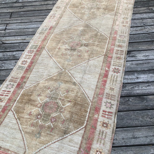 A Softly Aged Vintage Runner from Kars This vintage runner rug from Kars, Turkey, offers a timeless blend of strong...