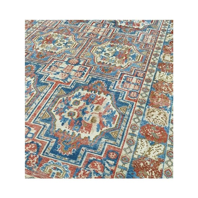 Unveil the beauty of Iran's heritage with this 7x10 Old Persian Bakhtiari rug. Handcrafted with intricate designs, it adds...