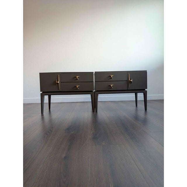 Cute set of grey mid century modern nightstands w/ stunning brass hardware, a pair of drawers and mirrored storage...