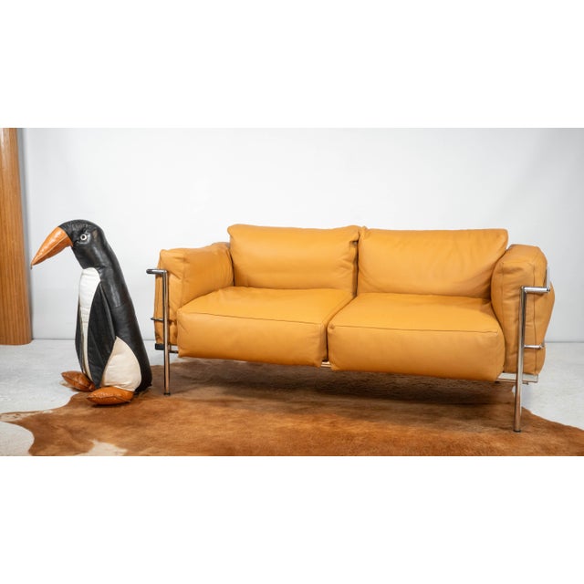 LC3 Grand Confort attributed love seat sofa in the manner of Le Corbusier for Cassina, circa early 2000s. Based upon the...