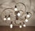 Large ceiling light featuring 2 tier with each 5 spiraling spokes, brushed bronze finish brass structure dimensions: h...