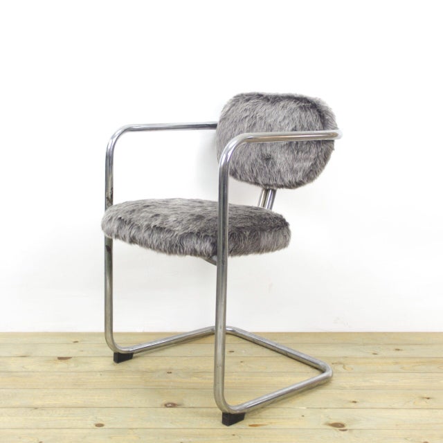 1970s chairs with chrome metal frame and upholstered with grey faux fur fabric.