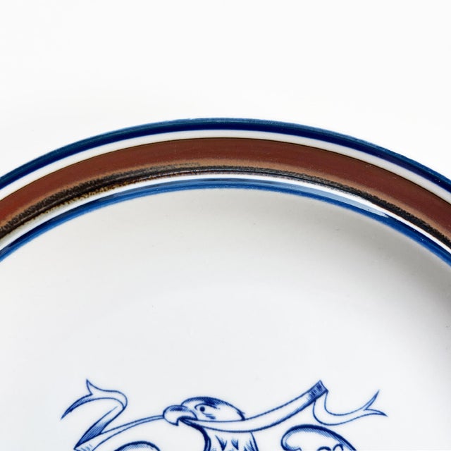 A classic American stoneware plate by Salem China, Ohio, featuring a beautifully rendered cobalt blue Federal eagle...