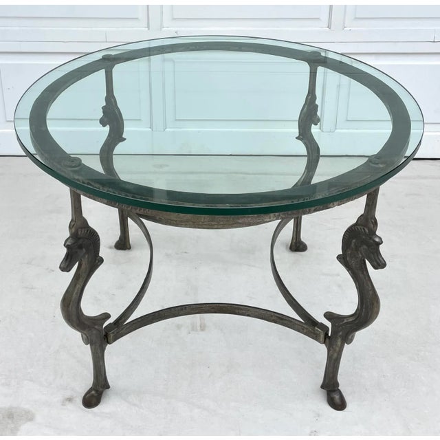 Here is an amazing vintage table that features a steel metal base with figurative horse heads on each of the 4 legs. The...