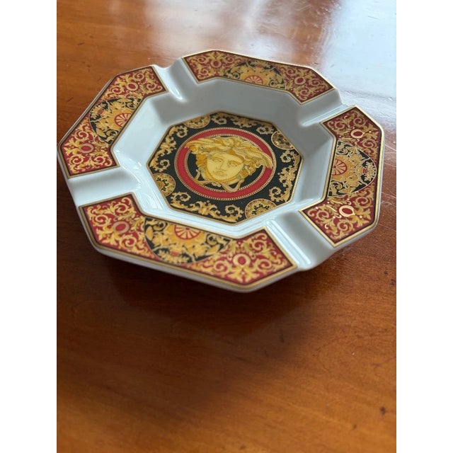 Immerse yourself in a world of luxury and elegance with this exquisite Versace Medusa ashtray from the renowned Rosenthal...