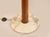 Stilnovo Modernist floor lamp. Designed for lighting manufacturer Domus. Crafted in teak with patinated brass details and...