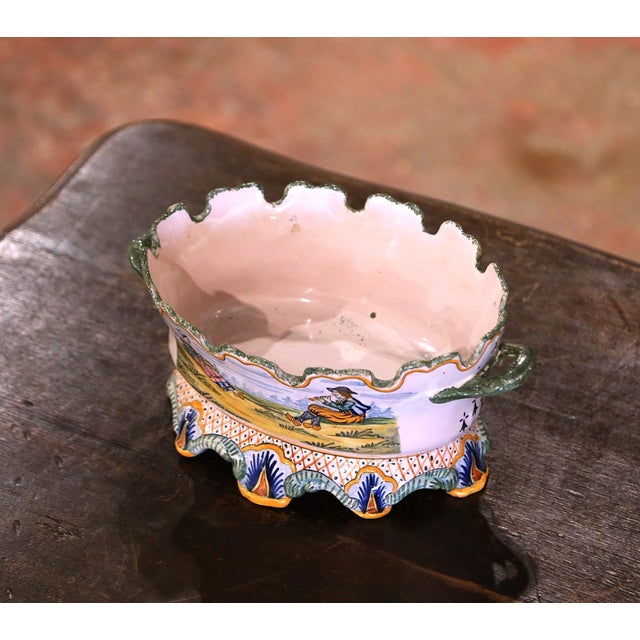 Decorate a buffet or table with this colorful antique faience jardiniere. Crafted in Brittany, France, circa 1880, the...