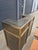 Striking vintage bar set featuring a sculptural brass-finished metal frame, dark inset panels and three matching bar...