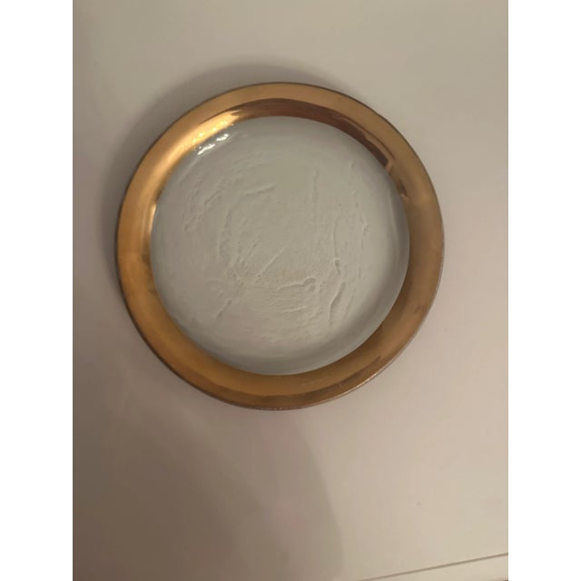 Annieglass is unique dinnerware made in the USA. It is made from recycled glass with 24 k gold fused to the concave edge...