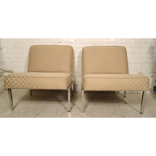 Mid-Century Modern slipper chairs with chrome base in the manner of Florence Knoll. Comfortable angled backs with polished...