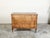 An Italian neoclassical period fruitwood commode from the early 19th century, with four drawers and marquetry décor....