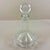 A vintage cut crystal decanter in the Ship Captains shape, with a top round stopper, circa early 1980s. The term “captains...