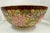 Exquisite Chinese hand-painted porcelain bowl, features an all-over floral motif in vibrant hues of pink, green, lavender,...