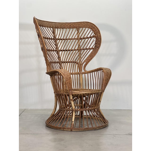 A wicker armchair made in the 1950s based on a design by Gio Ponti and Lio Carminati for the ship Conte Biancamano; the...