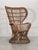 A wicker armchair made in the 1950s based on a design by Gio Ponti and Lio Carminati for the ship Conte Biancamano; the...