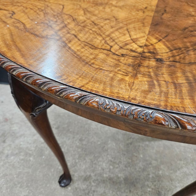 This Walnut Queen Anne Oval Convertible Game Table With Cabriole Legs is a lovely piece. It has a dragooned top that lifts...