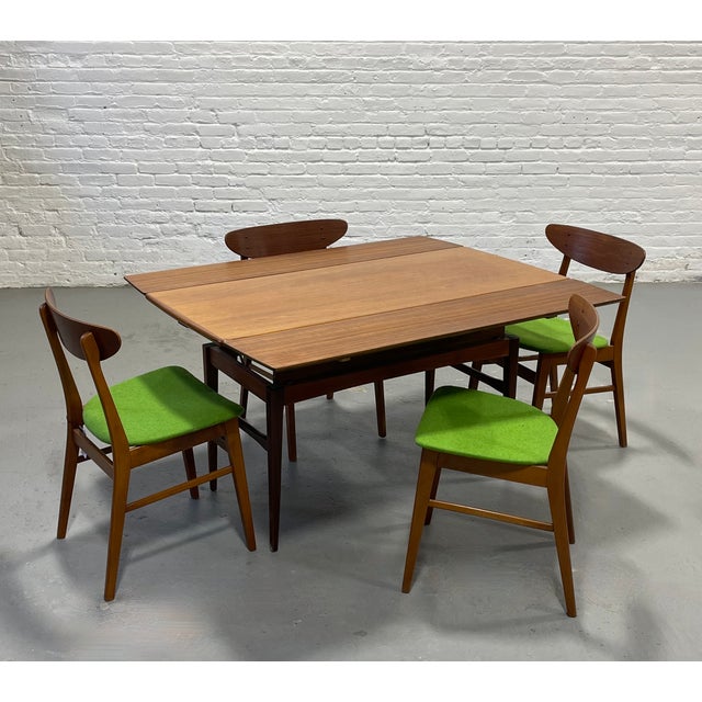 This vintage Mid Century Modern gem easily converts from a coffee table to a desk or console or to a full size dining...