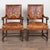 Pair of 19th century hand painted and embossed leather armchairs. Crafted in oak, these Rococo style armchairs feature...