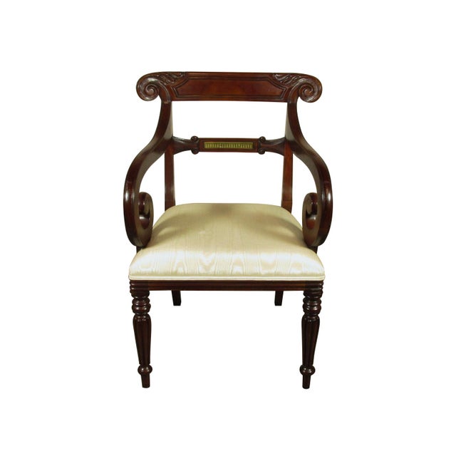 A set six (4 arm chairs and 2 sides) Regency style mahogany dining chairs by Maitland Smith. Maitland Smith is an American...
