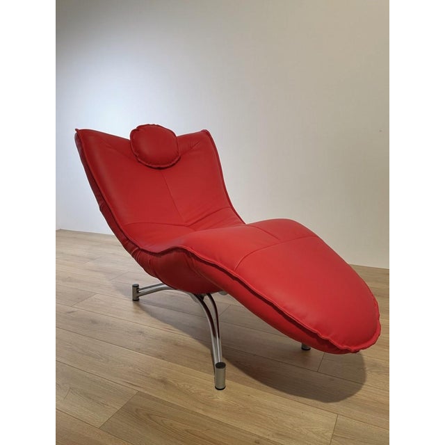 DS 151 chaise longue by Jane Worthington for the Swiss company De Sede. The chair has a metal frame and a red faux leather...