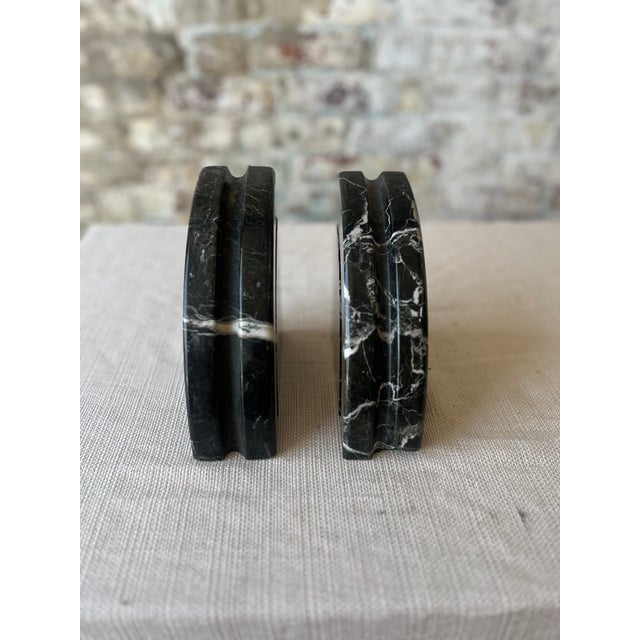 Elevate your shelves with this striking pair of vintage solid marble bookends. Crafted from polished black marble with...