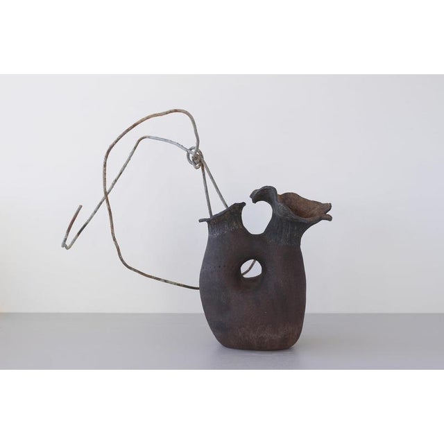 Generation 11 by Eguzkiñe Egaña Unique Dimensions: W 26 x L 14.5 x H 32 cm Materials: Black stoneware and iron. In this...