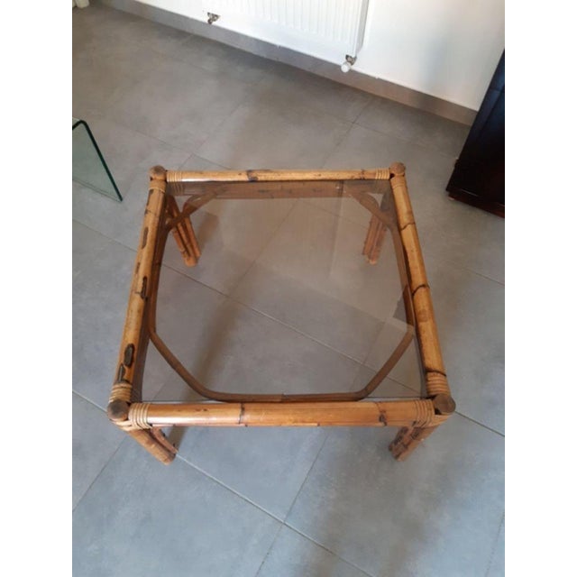 Antique coffee table. Made of rattan and bamboo. Period: 1960-1970. Honey chestnut color. Smoked glass top in perfect...