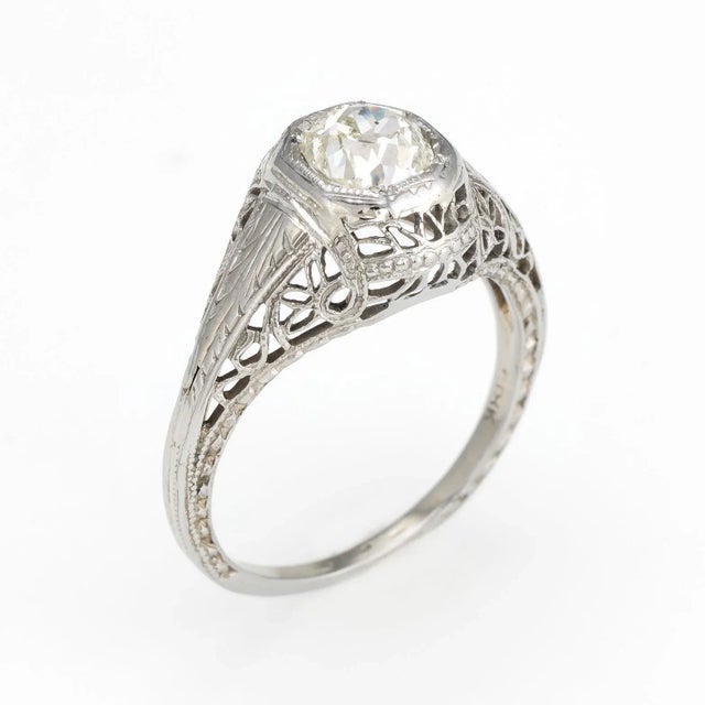 Elegant & finely detailed Art Deco era ring (circa 1920s to 1930s), crafted in 18 karat white gold. Centrally mounted...