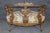 Remarkable, sculptural, and richly expressive, this early 20th century Italian carved figural chair settee is a masterful...