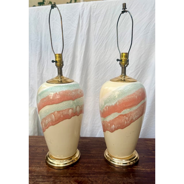 Bring a little 1980's visual drama to your decor with this striking pair of vintage postmodern ceramic table lamps. A cool...