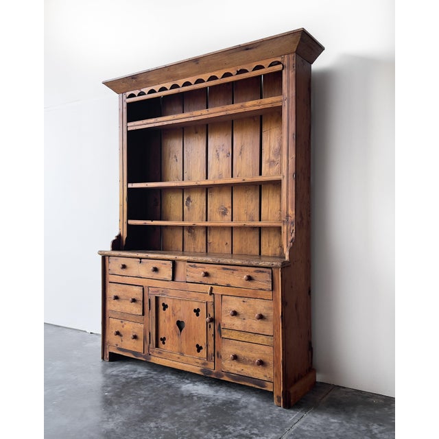 A magnificent mid-late 19th century Irish pine dresser with fantastic patina and a soft, hand-waxed finish. The upper...