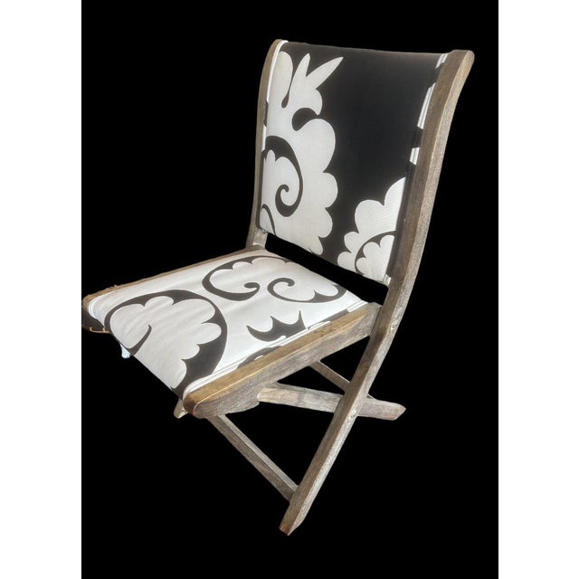 Anthropologie vintage solid wood folding chair. Block print cotton linen fabric, webbed seat construction with form fiber...