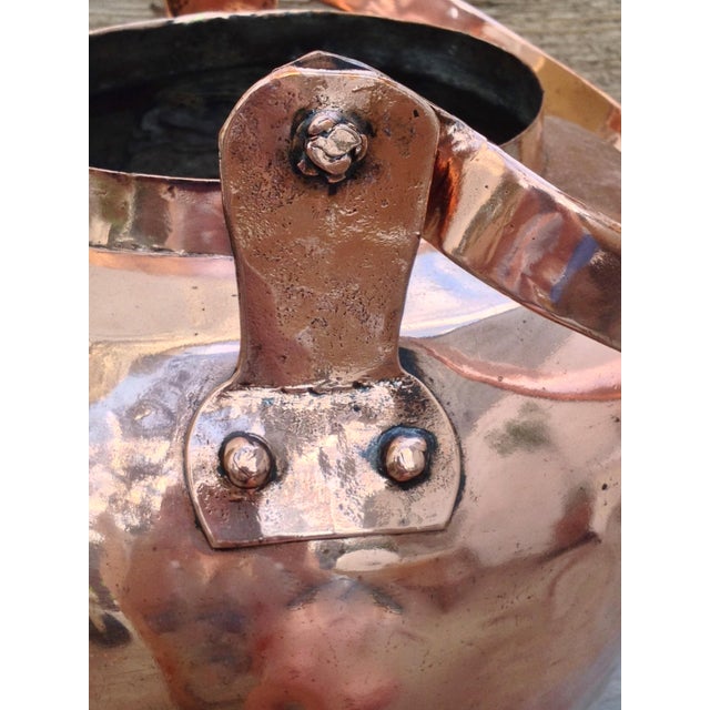 Large and rare antique copper water kettle pot with a broad copper swivel handle ca.1860. A heavy pot features dovetailed...