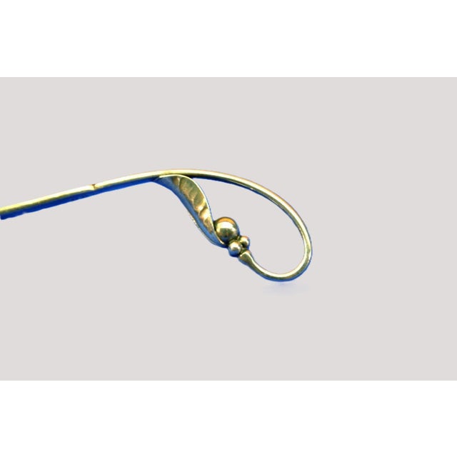 Offered here is a beautifully designed Georg Jensen sterling silver spoon in the sought-after Blossom / No. 21 pattern,...