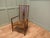 A Liberty Morris & Co Rush Seated Low Armchair This piece is being offered from a dispersal sale of Arts and Crafts,...