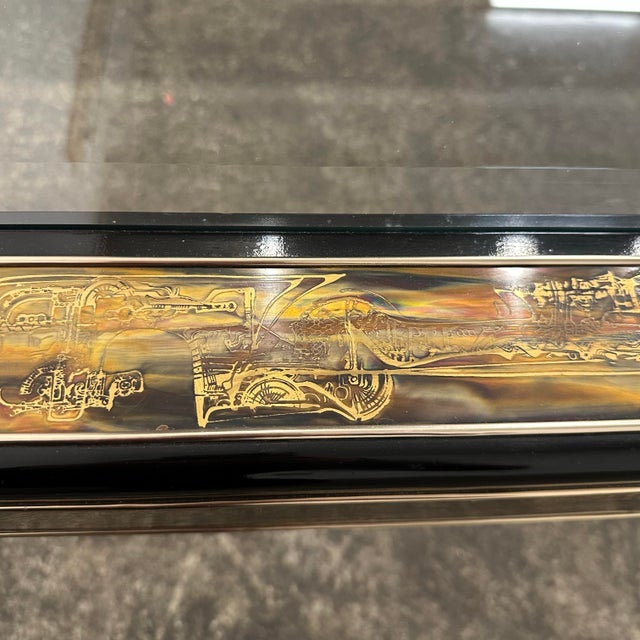 This is a Bernhard Rohne for Mastercraft acid-etched brass and black lacquered coffee table. This coffee table features...