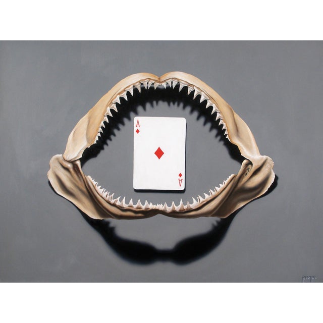 This artwork presents a striking juxtaposition between the formidable jaws of a shark and the simplicity of an Ace of...