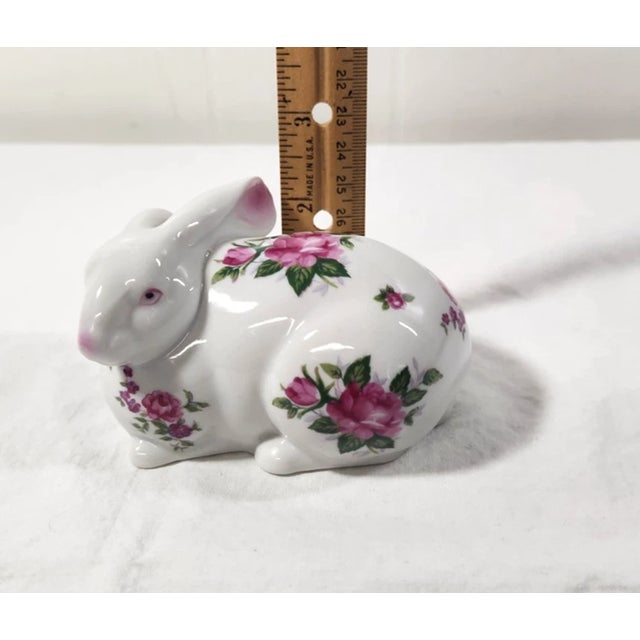 Delight in the charm of this vintage porcelain bunny rabbit figurine, a beautifully crafted piece that captures both...