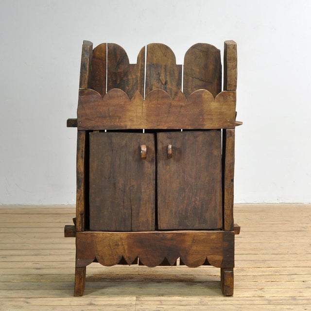 Romanian folk cabinet presumably dating from the first half of the 20th century, entirely handcrafted from solid wood and...