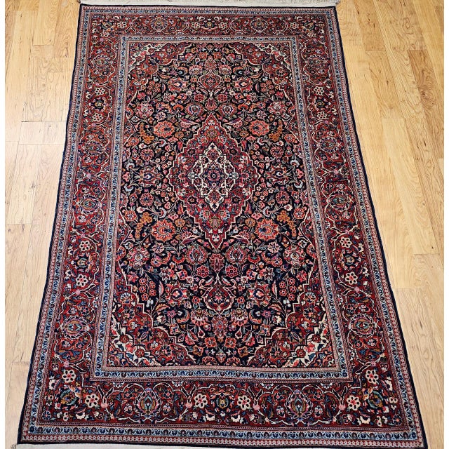 "Quintessential elegance and refined artistry showcased in this vintage Persian Kashan area rug, meticulously hand-knotted...