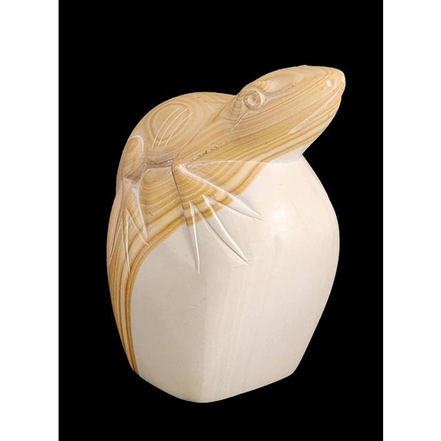 Offered is a divine little hand carved lizard perched on a rock in a heavy piece of soap stone. The vein of the soap stone...