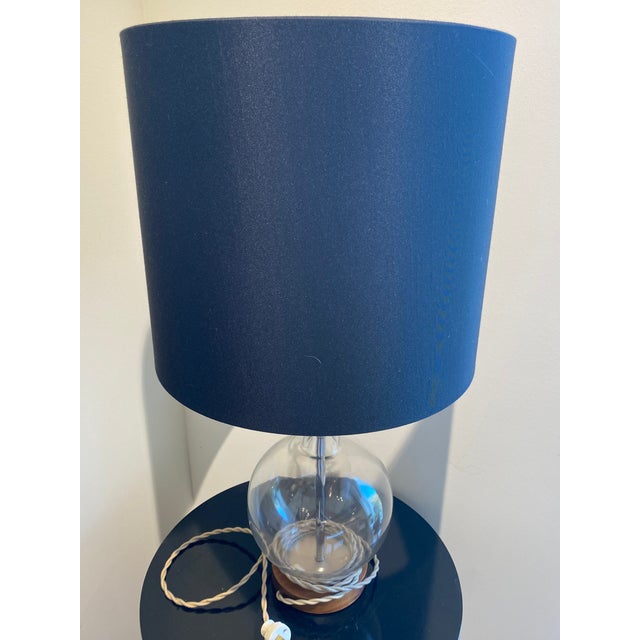 Elevate your interior with this striking contemporary table lamp, a perfect blend of modern minimalism and classic...