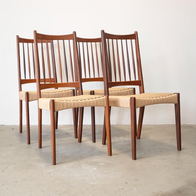 Originally designed by Arne Hovmand Olsen for Mogens Kold in the 1950s, this set of four high back dining chairs has had...